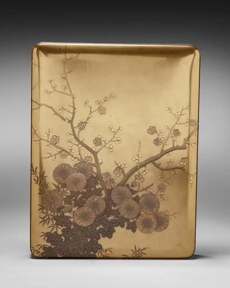 A box lid seen from above, its surface decorated with plum blossom